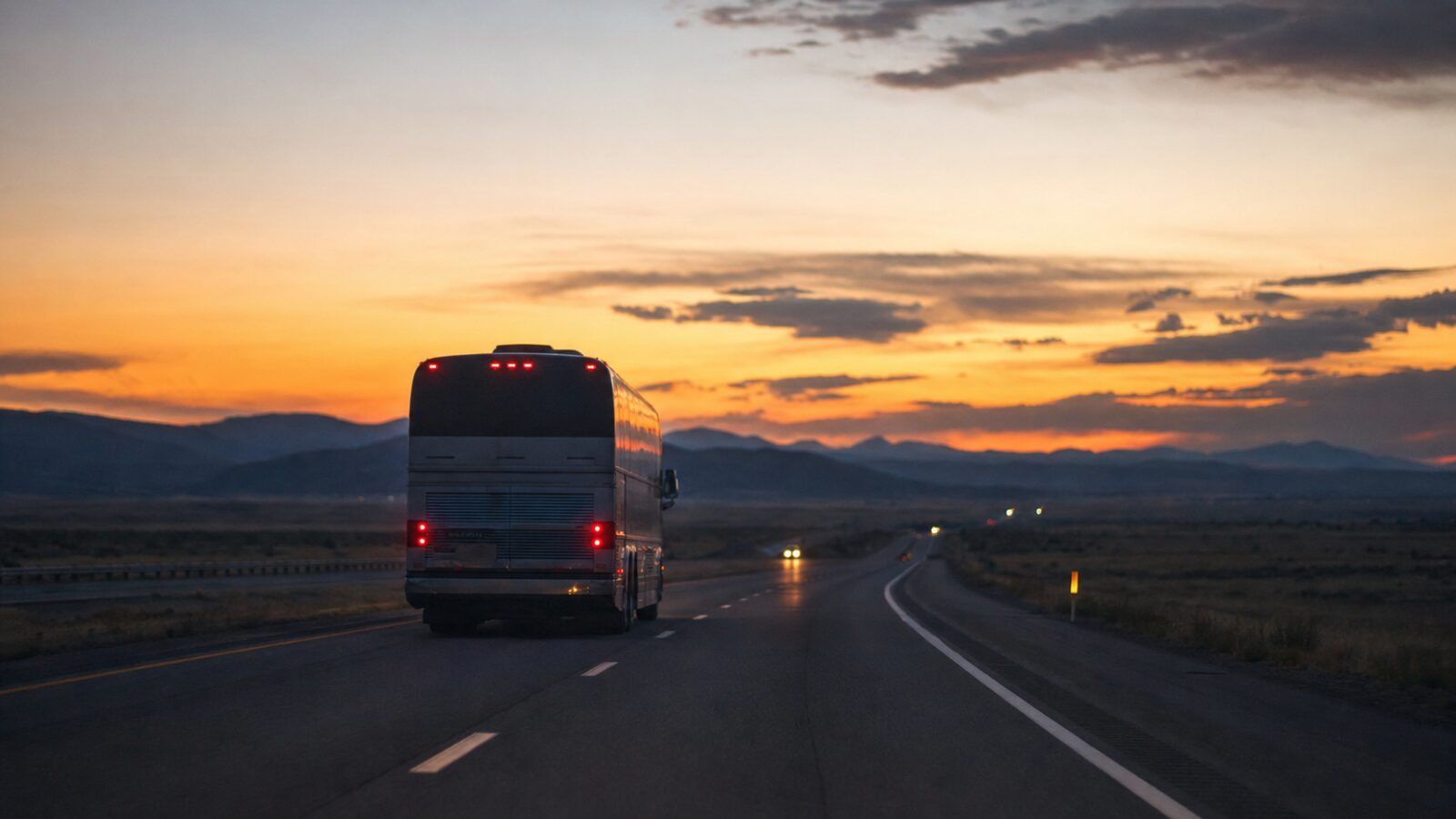 Tour bus on highway at dusk