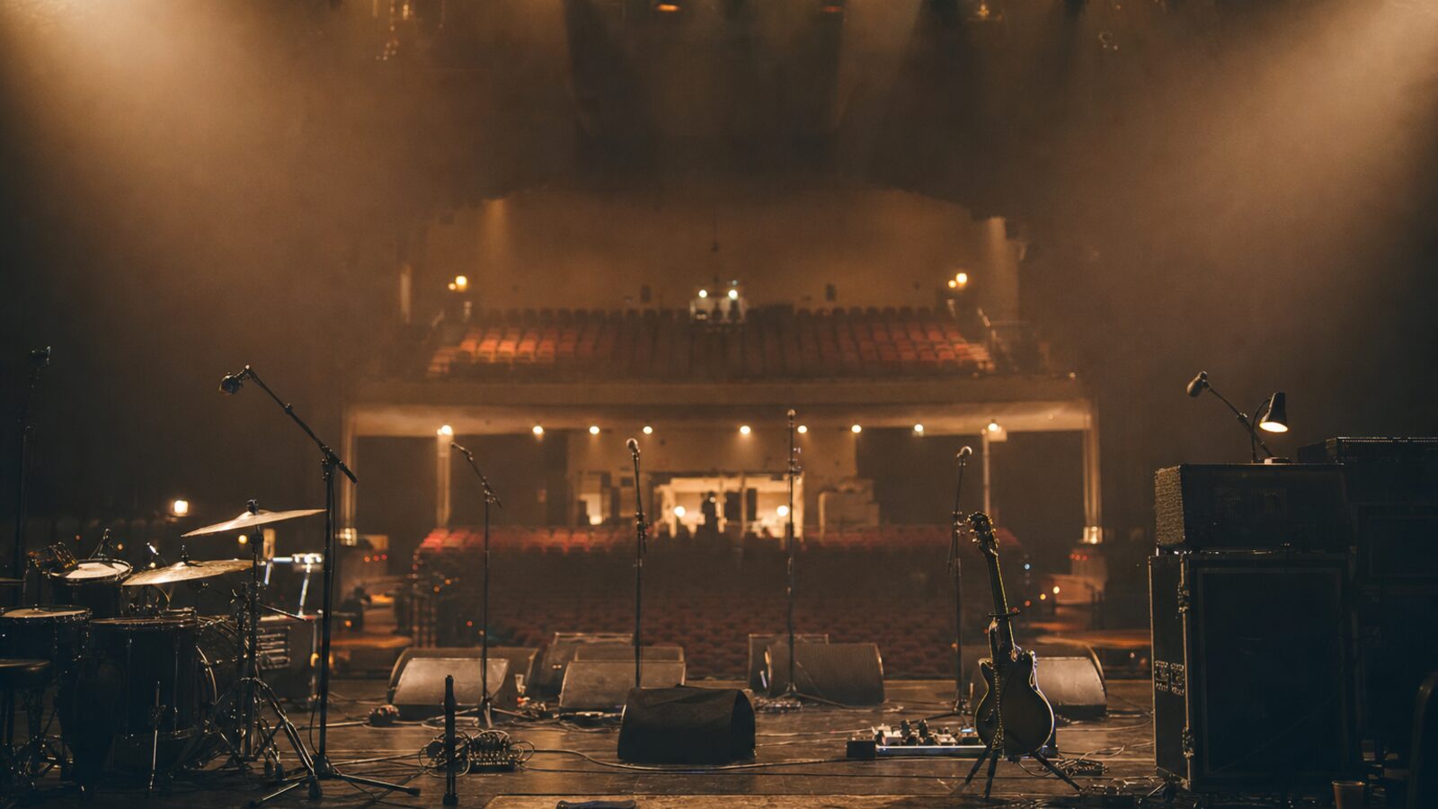 Concert stage with monitors microphones and amps before soundcheck